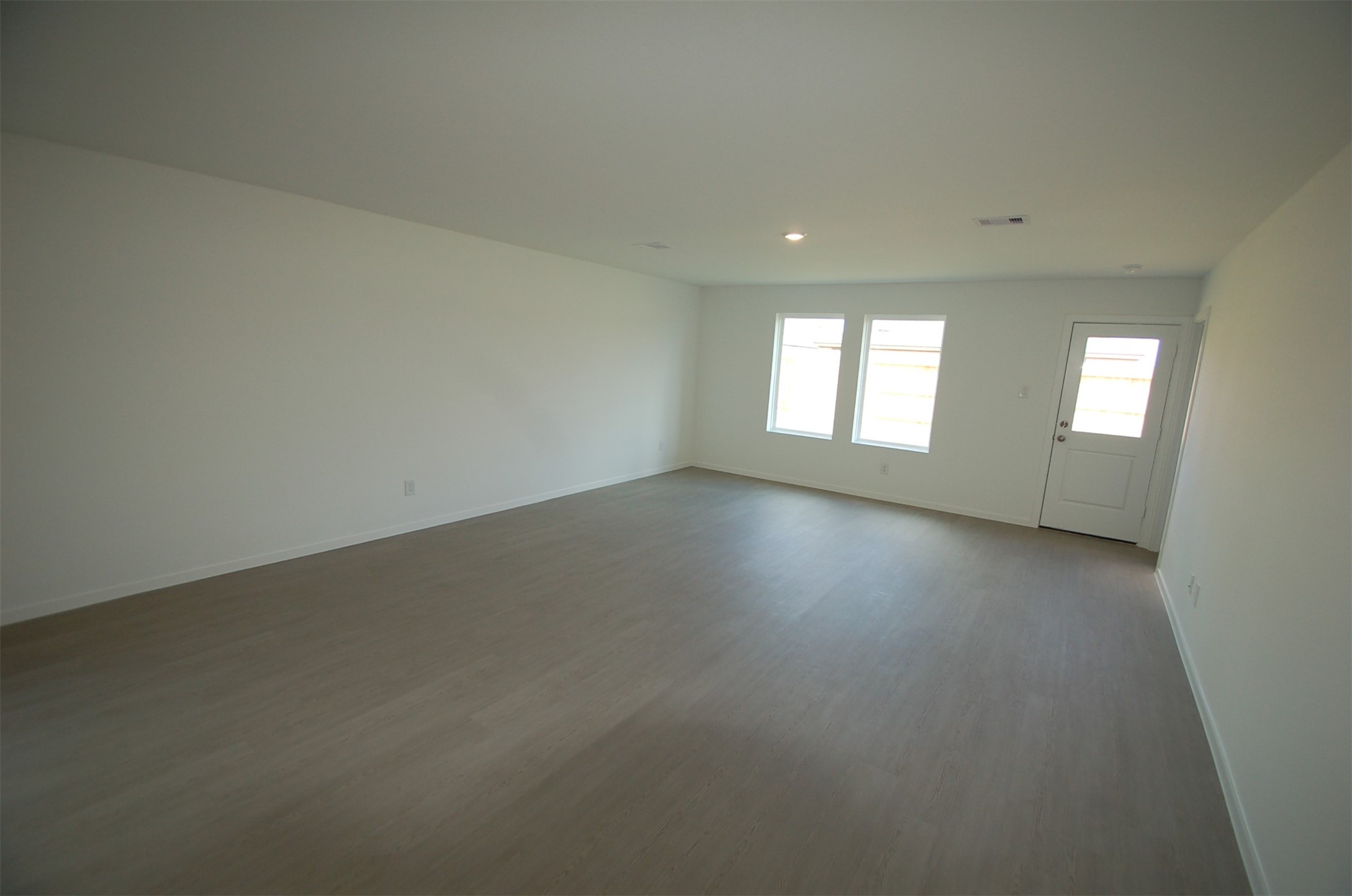 16130 Rustic Prairie Hockley, TX 77447 - Photo 2 of 21 an empty room with windows