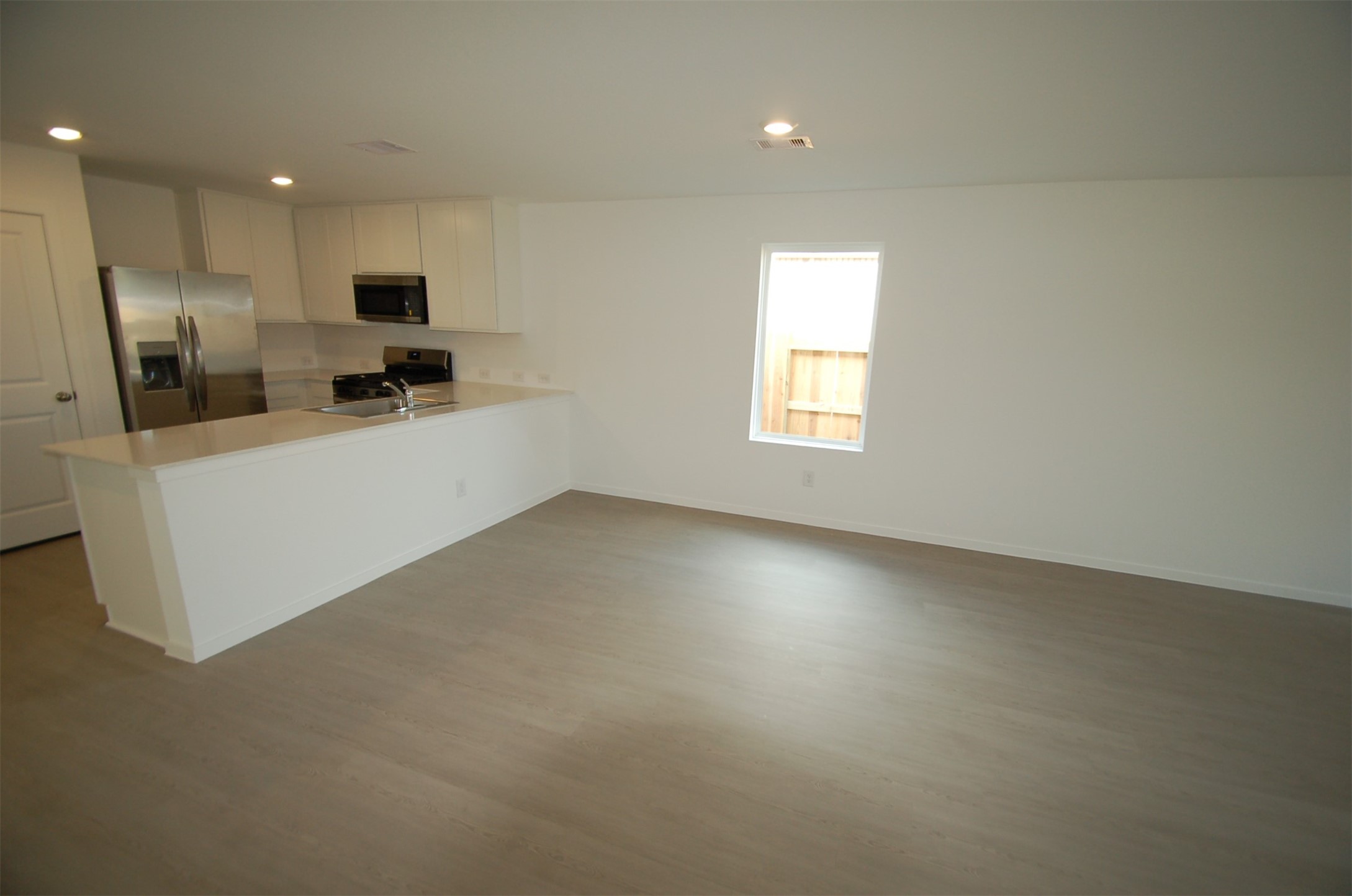 16130 Rustic Prairie Hockley, TX 77447 - Photo 3 of 21 a view of a kitchen with furniture and refrigerator