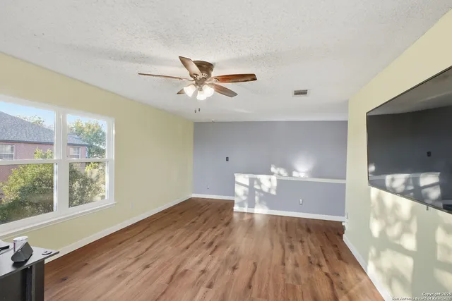 a bed room with a bed and a chair