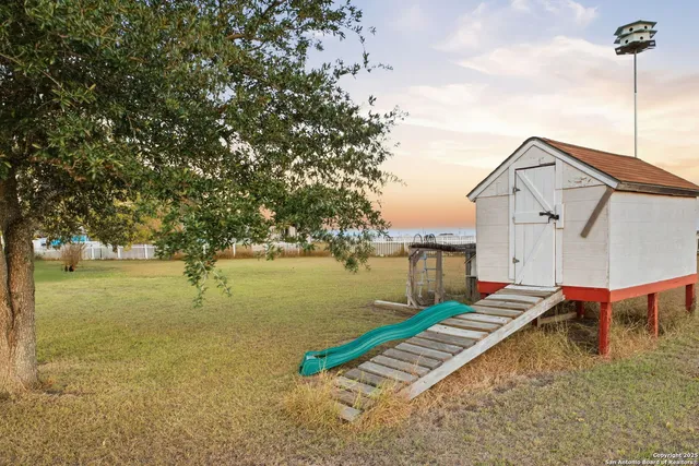 an aerial view of residential houses with outdoor space
