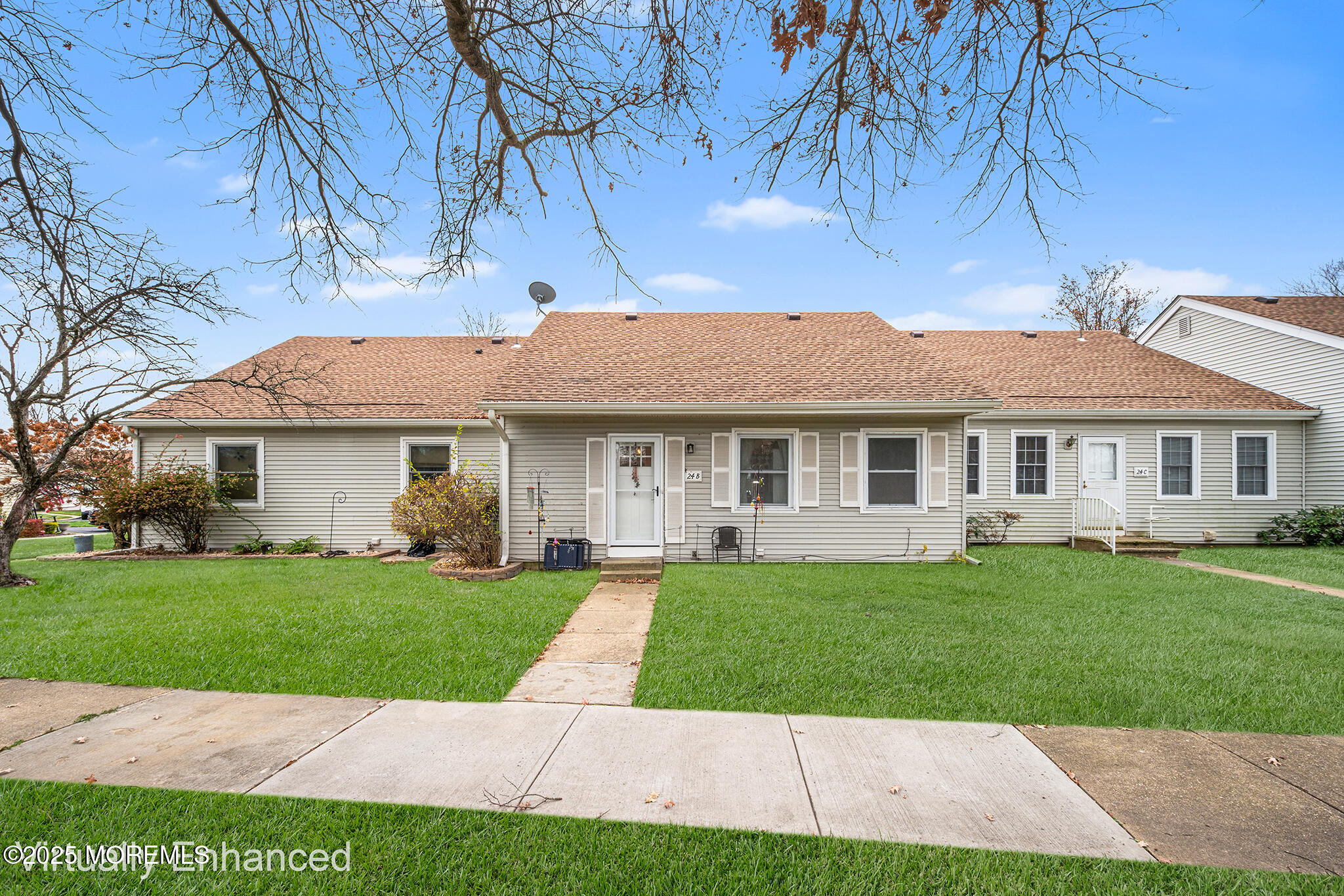 24 Calle De Elvira, Unit B Freehold, NJ 07728 - Photo 1 of 25 a front view of a house with a garden