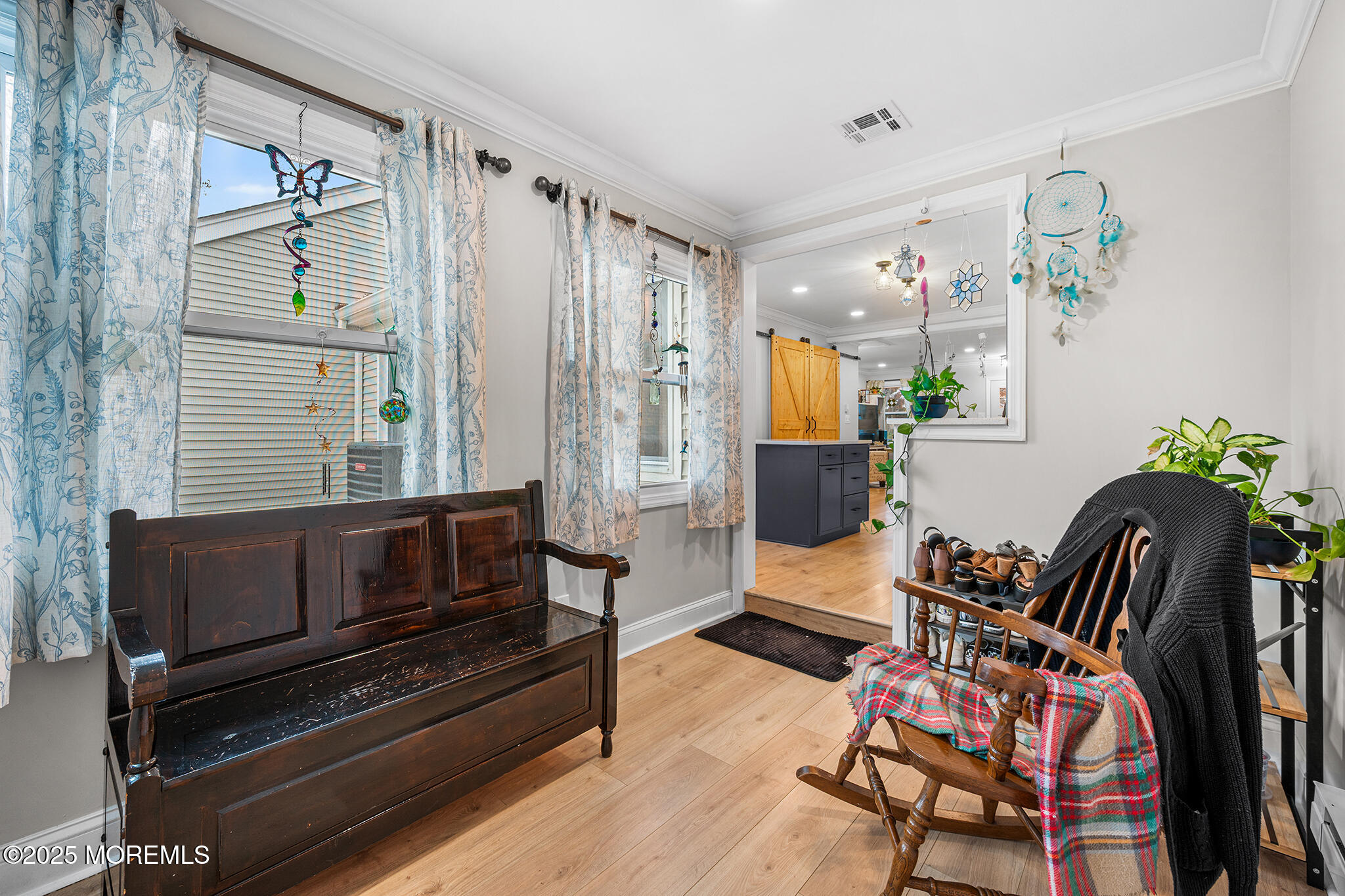 24 Calle De Elvira, Unit B Freehold, NJ 07728 - Photo 15 of 25 a living room with furniture and wooden floor