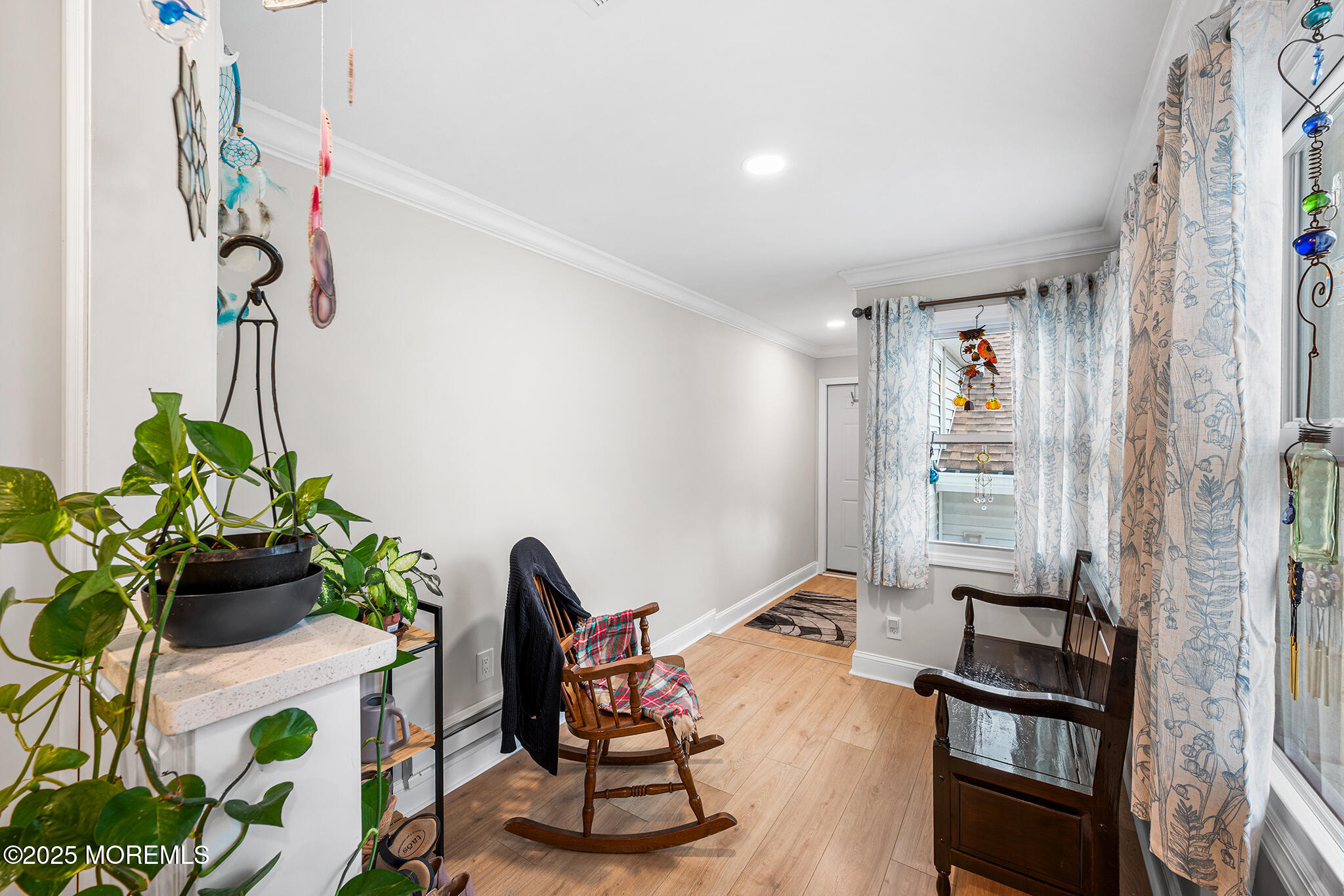 24 Calle De Elvira, Unit B Freehold, NJ 07728 - Photo 16 of 25 a living room with furniture and a window