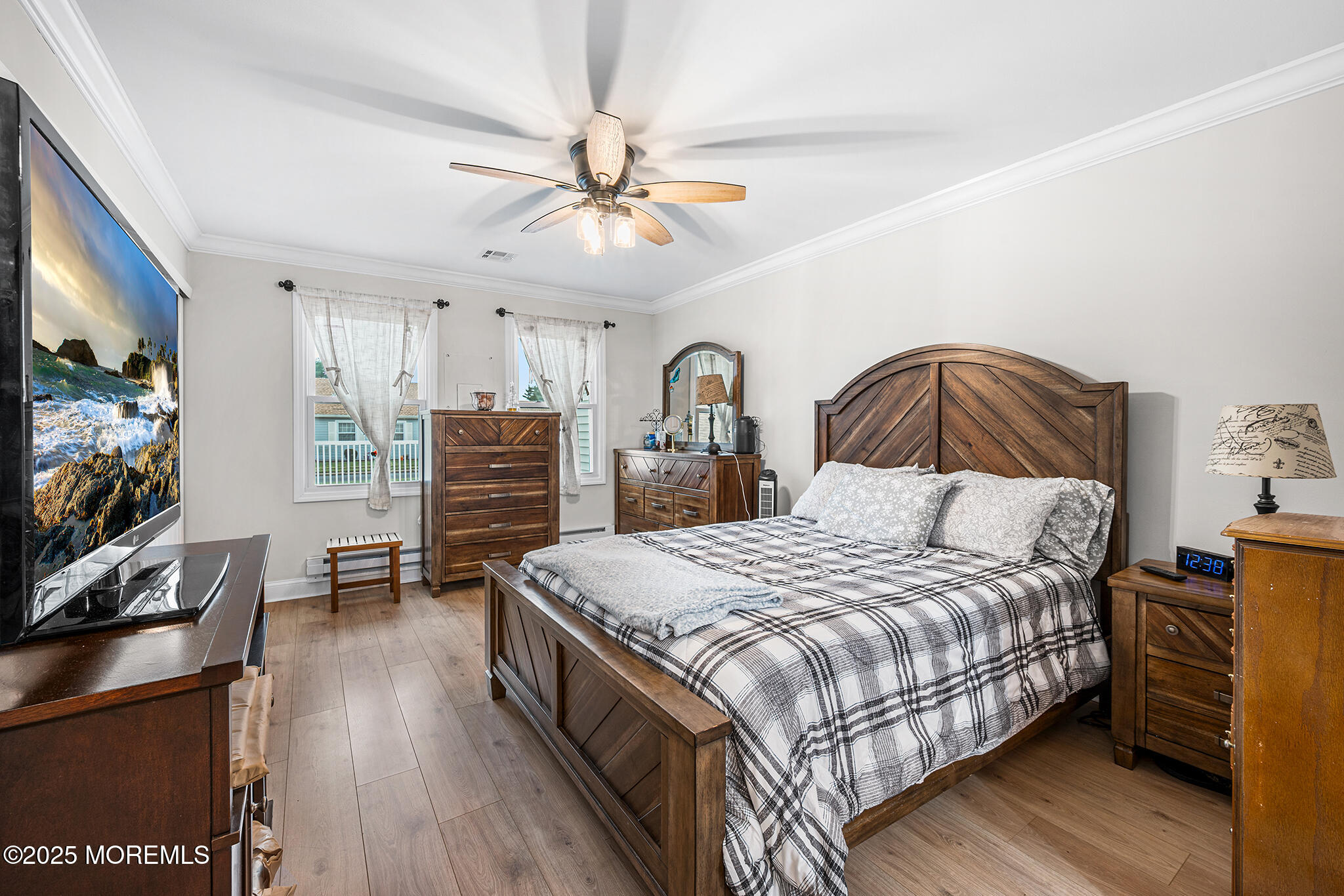 24 Calle De Elvira, Unit B Freehold, NJ 07728 - Photo 17 of 25 a bedroom with a bed and a flat screen tv