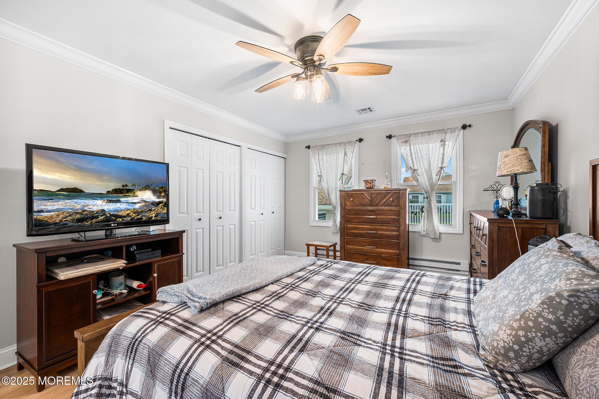 24 Calle De Elvira, Unit B Freehold, NJ 07728 - Photo 20 of 25 a bedroom with a bed and a flat screen tv