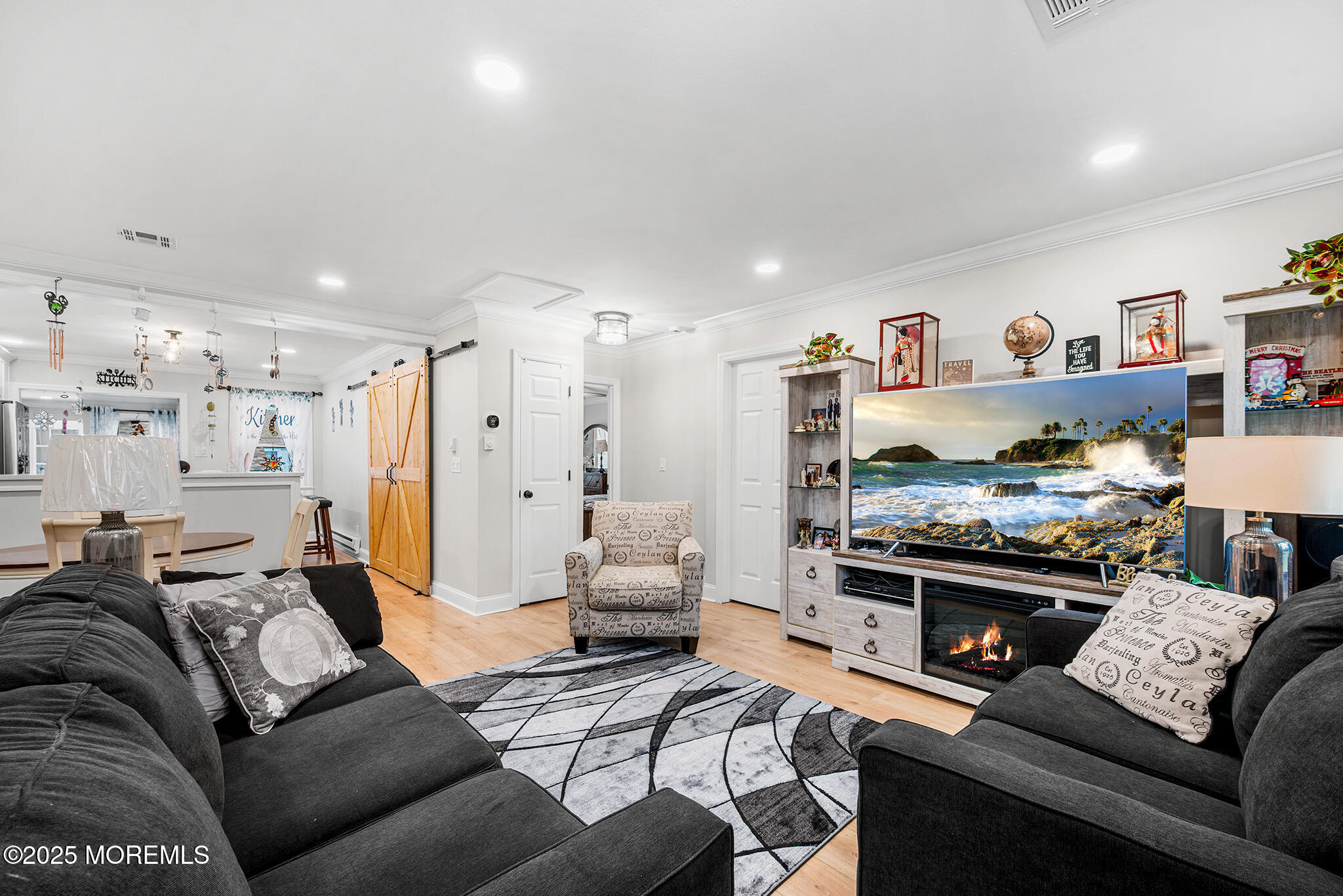 24 Calle De Elvira, Unit B Freehold, NJ 07728 - Photo 4 of 25 a living room with furniture and a flat screen tv