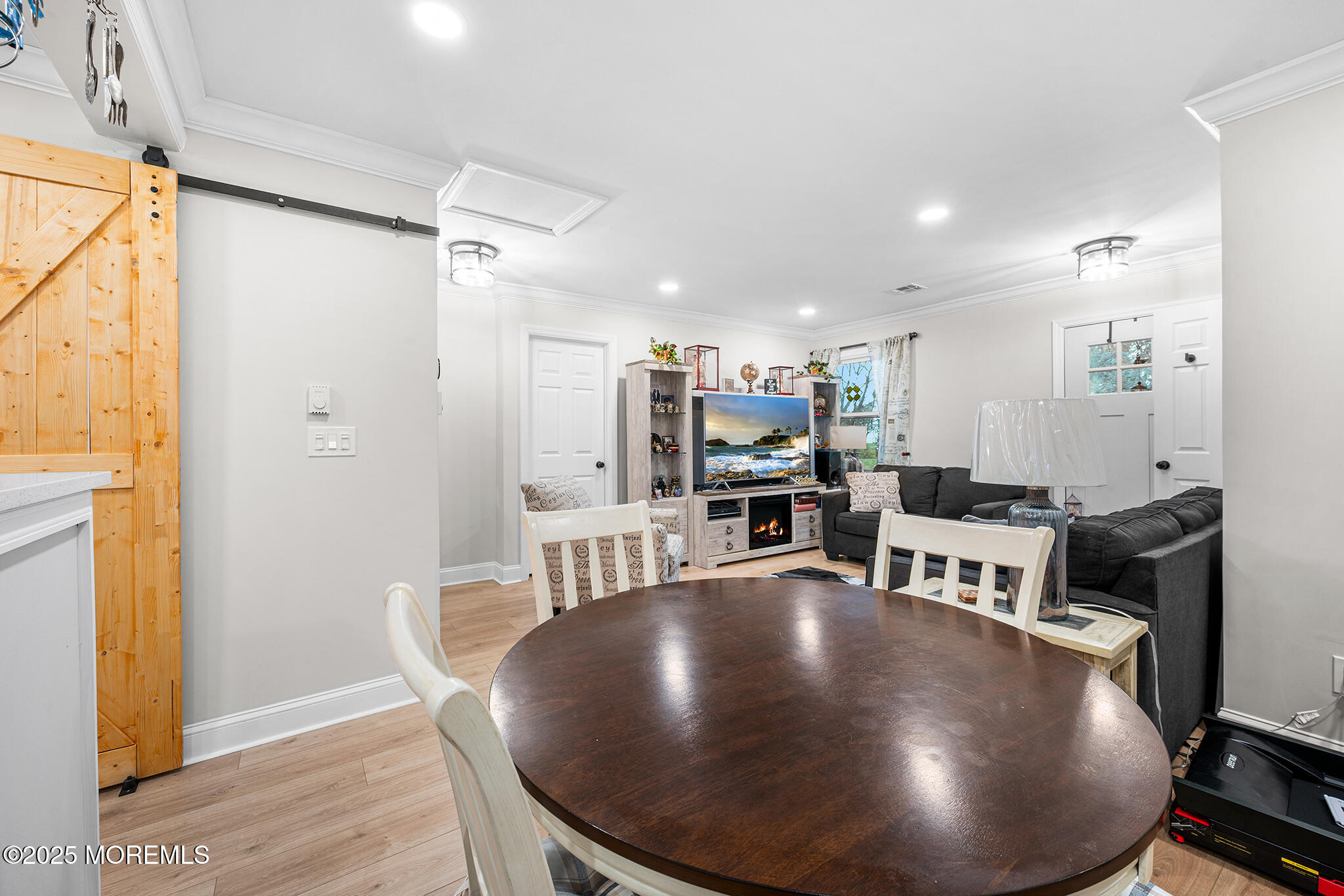 24 Calle De Elvira, Unit B Freehold, NJ 07728 - Photo 9 of 25 a view of a dining room with furniture and wooden floor