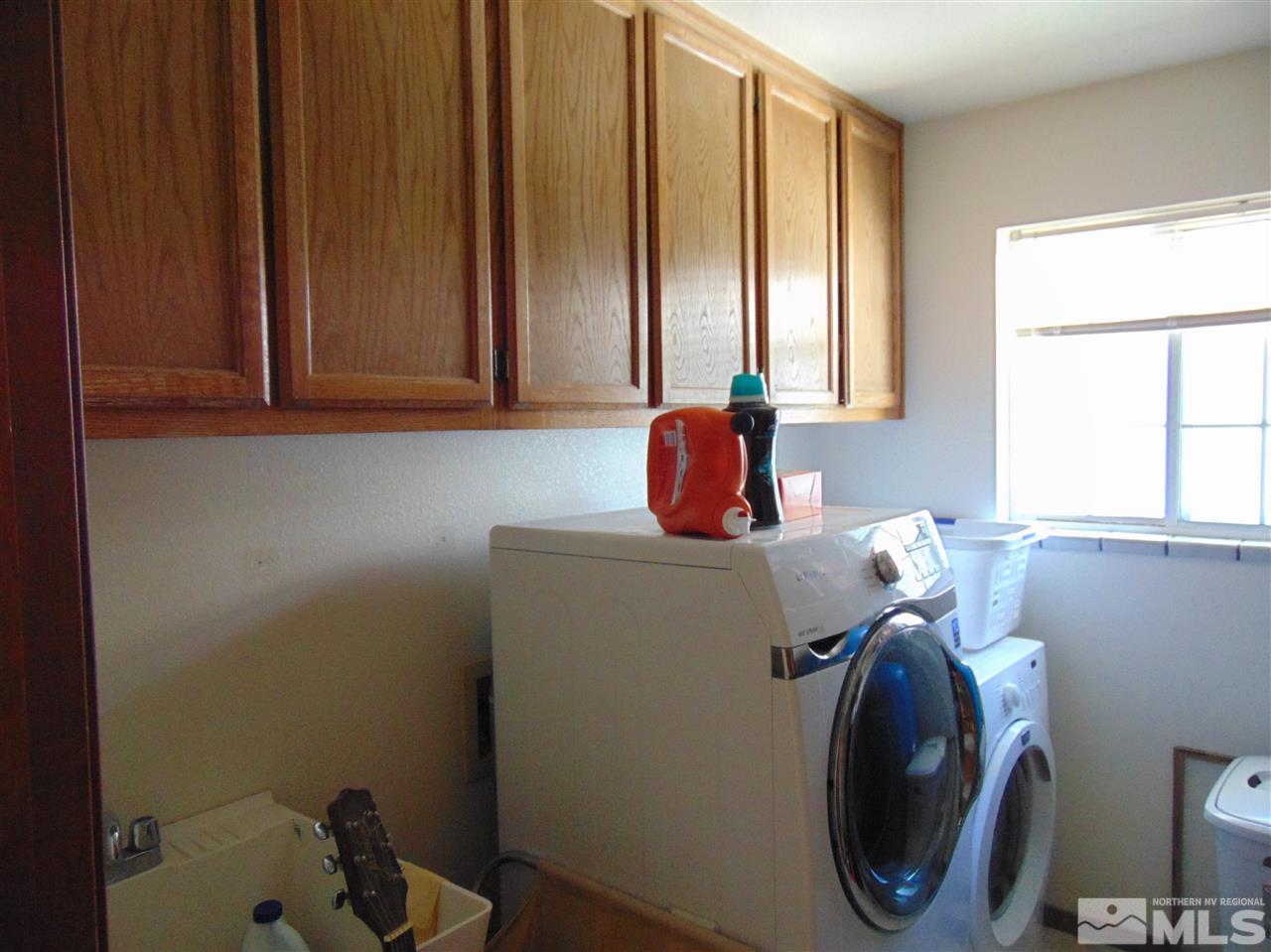 3255 Alcorn Road Fallon, NV 89406 - Photo 13 of 25 a room with a fan and a window