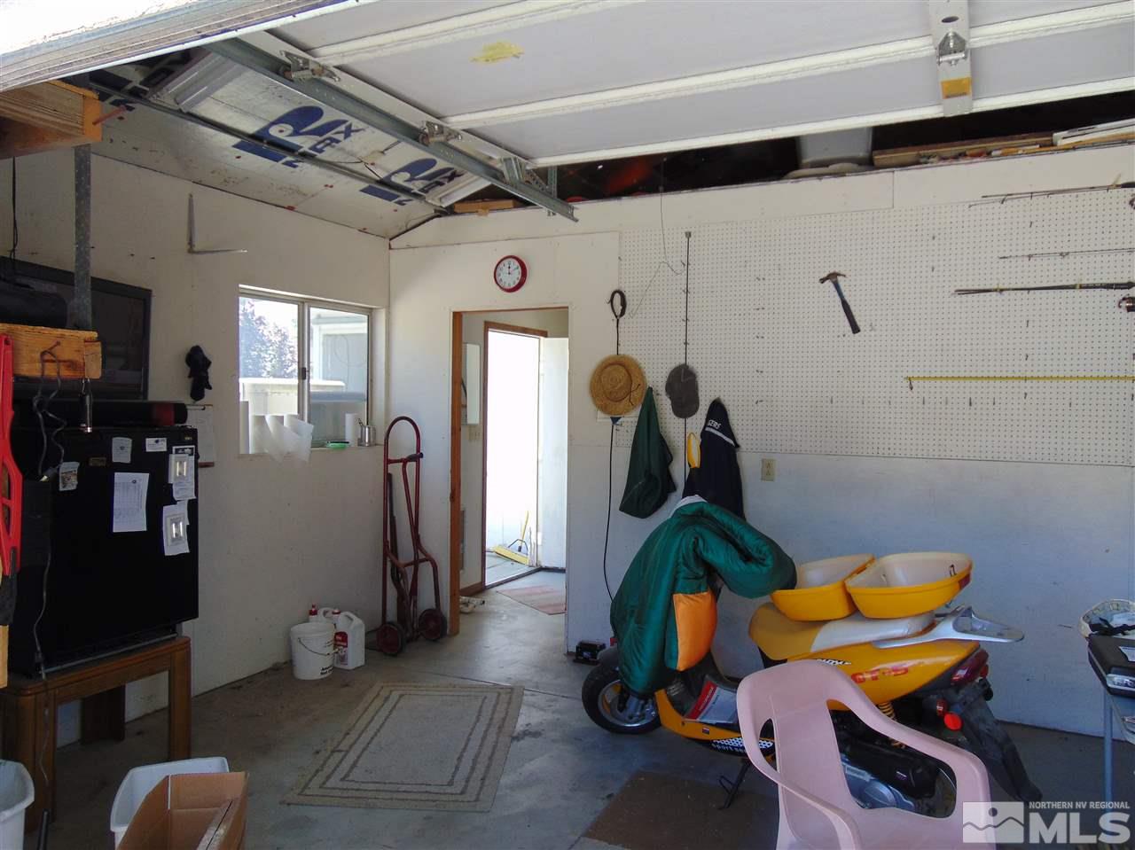 3255 Alcorn Road Fallon, NV 89406 - Photo 24 of 25 a room with gym equipment and mirrors