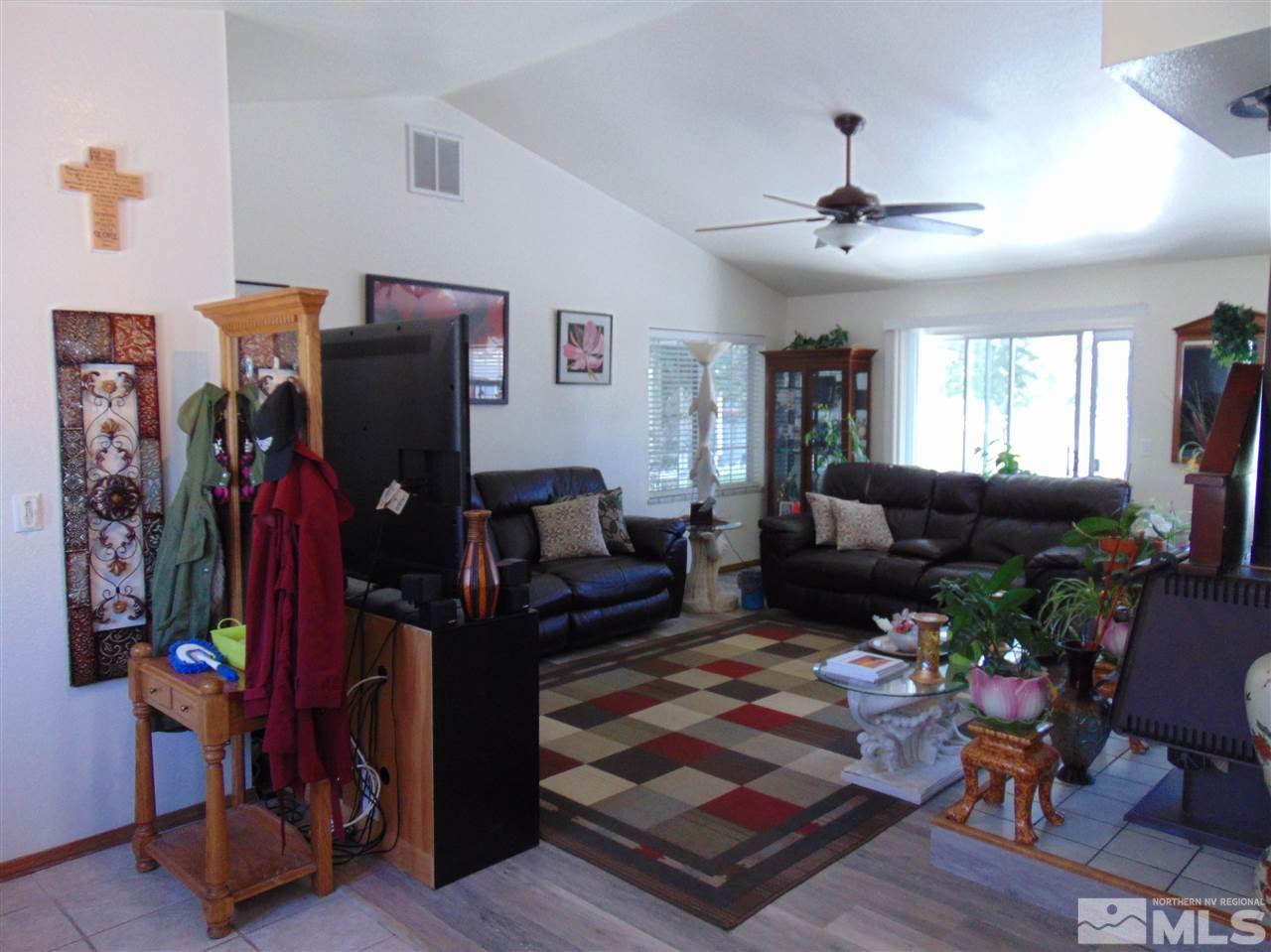 3255 Alcorn Road Fallon, NV 89406 - Photo 3 of 25 a living room with furniture and a flat screen tv