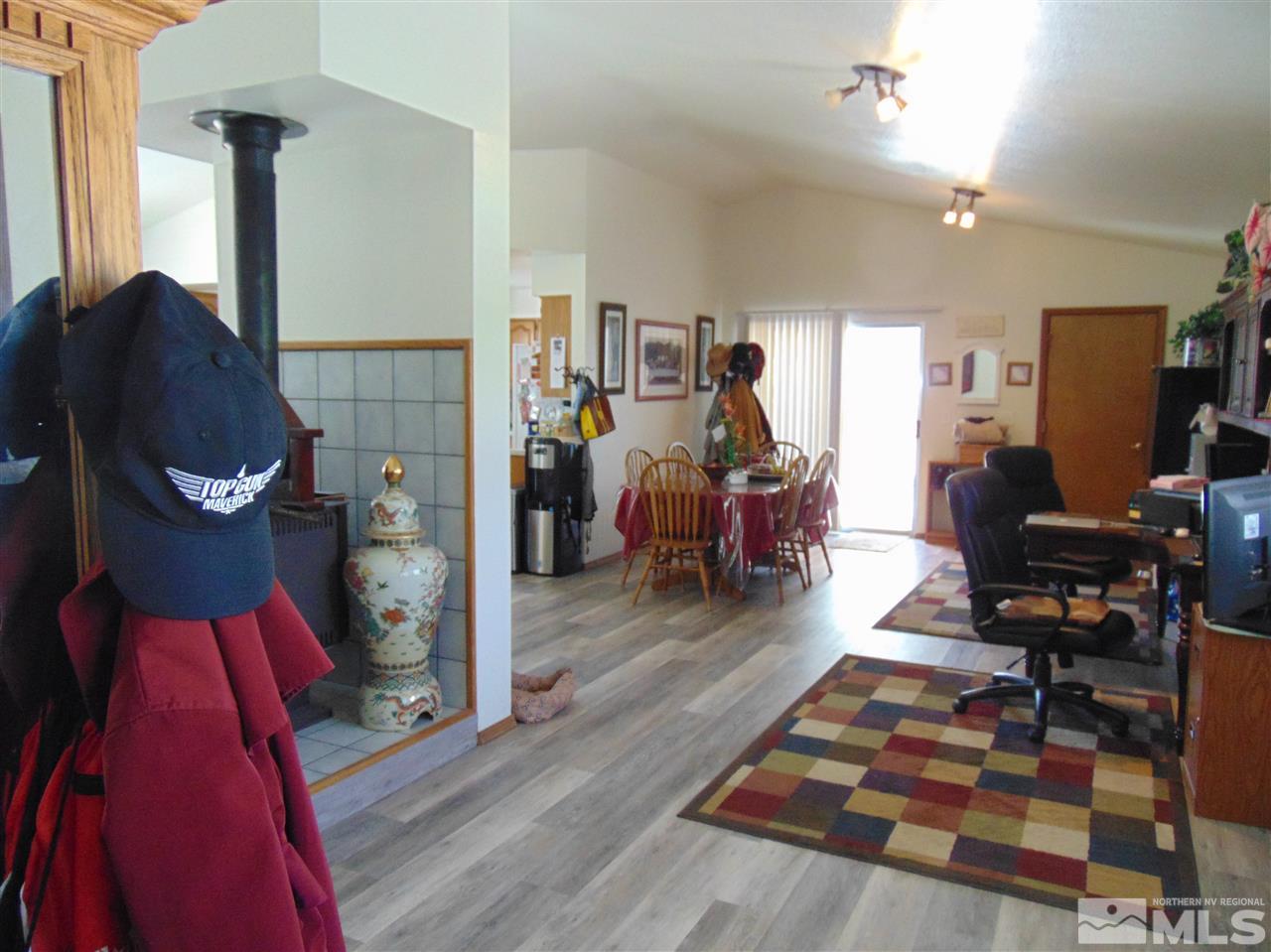 3255 Alcorn Road Fallon, NV 89406 - Photo 4 of 25 a living room with furniture a rug and a flat screen tv