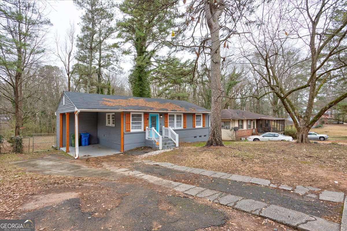 130 Mount Zion Road Southwest Atlanta, GA 30354 - Photo 15 of 22 a view of a house with a yard covered in snow