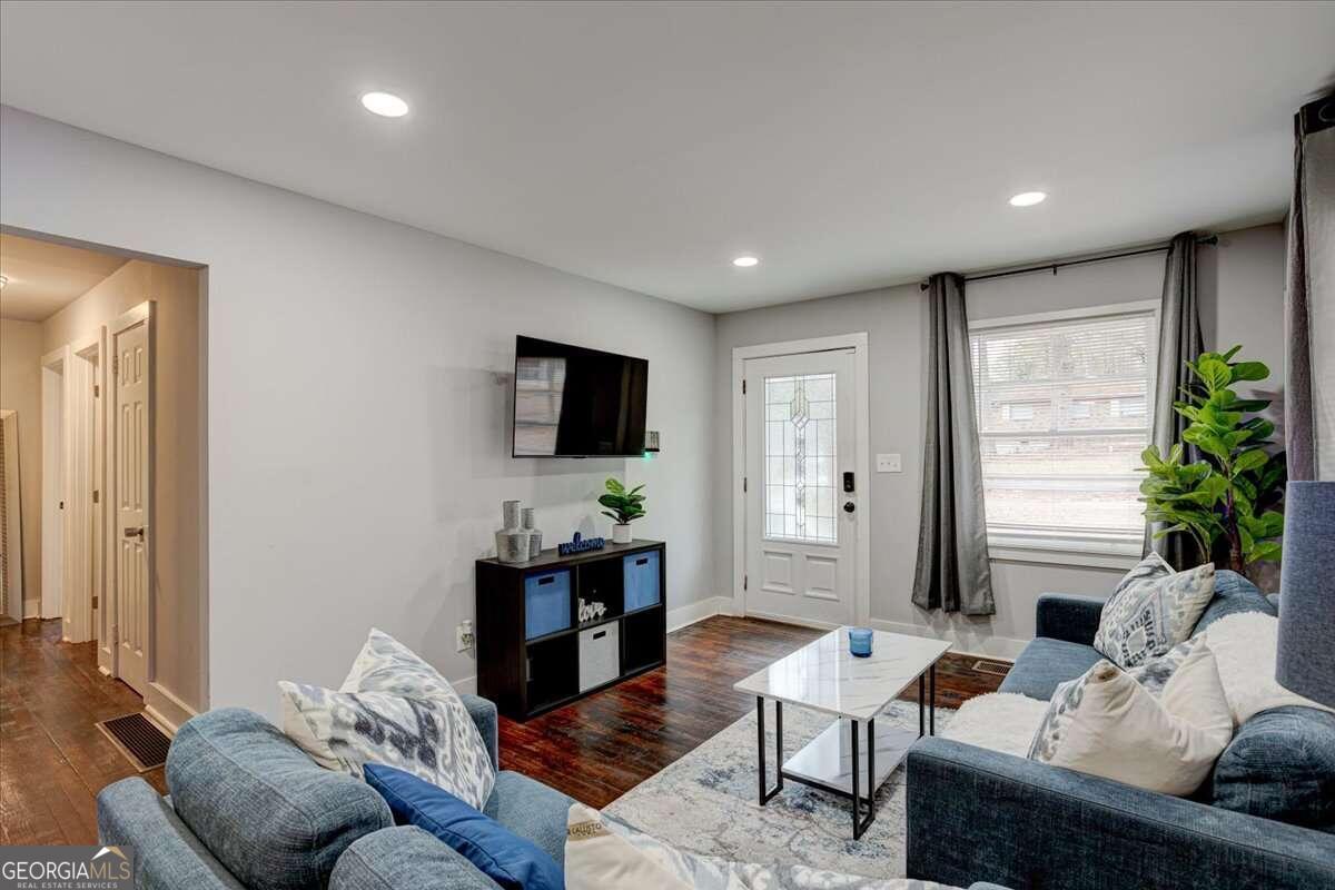 130 Mount Zion Road Southwest Atlanta, GA 30354 - Photo 2 of 22 a living room with furniture and a flat screen tv