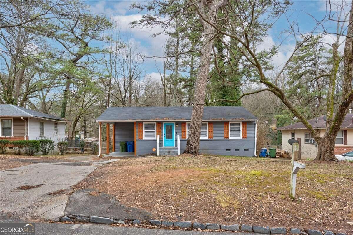 130 Mount Zion Road Southwest Atlanta, GA 30354 - Photo 3 of 22 a front view of a house with a yard