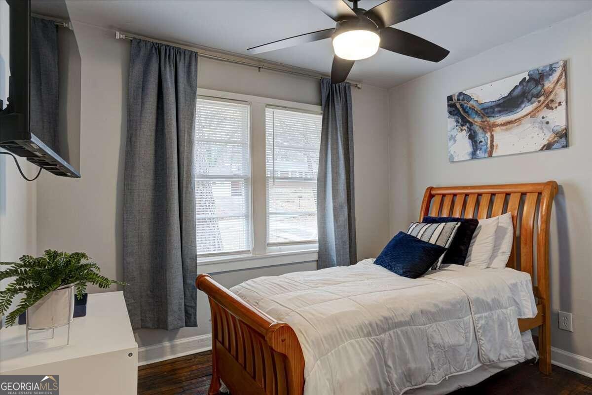 130 Mount Zion Road Southwest Atlanta, GA 30354 - Photo 10 of 22 a bedroom with a bed and a potted plant