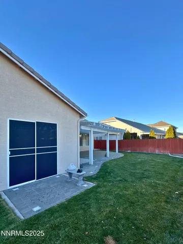 a view of a house with a yard and porch