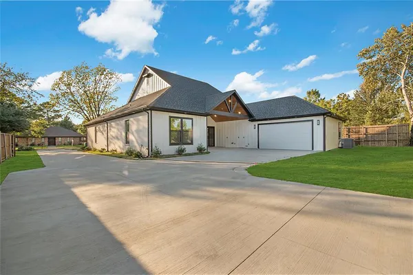 a front view of a house with garage