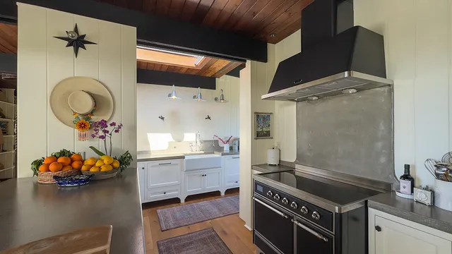 a kitchen with a wooden floor and a stove