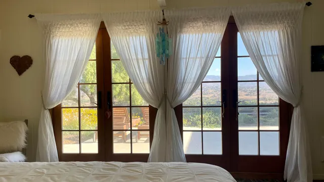 a view of a bedroom with windows
