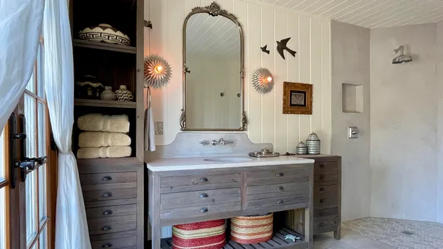a bathroom with a double vanity sink and a mirror