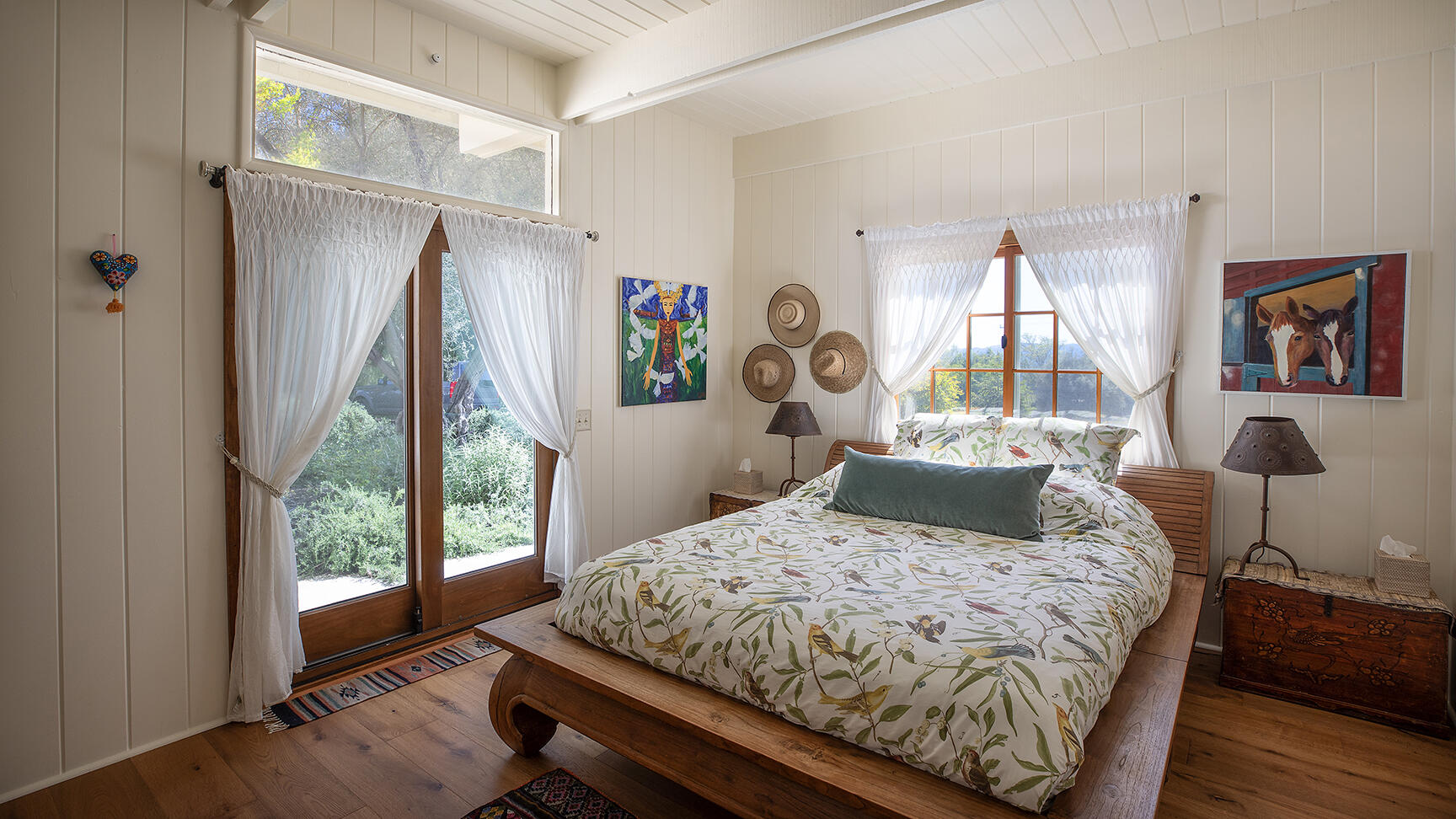 2852 Tapadero Road Solvang, CA 93463 - Photo 17 of 52 a bedroom with a bed wooden floor and a large window