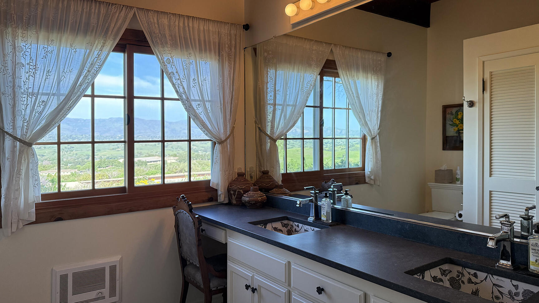 2852 Tapadero Road Solvang, CA 93463 - Photo 18 of 52 a kitchen with a sink a window and cabinets