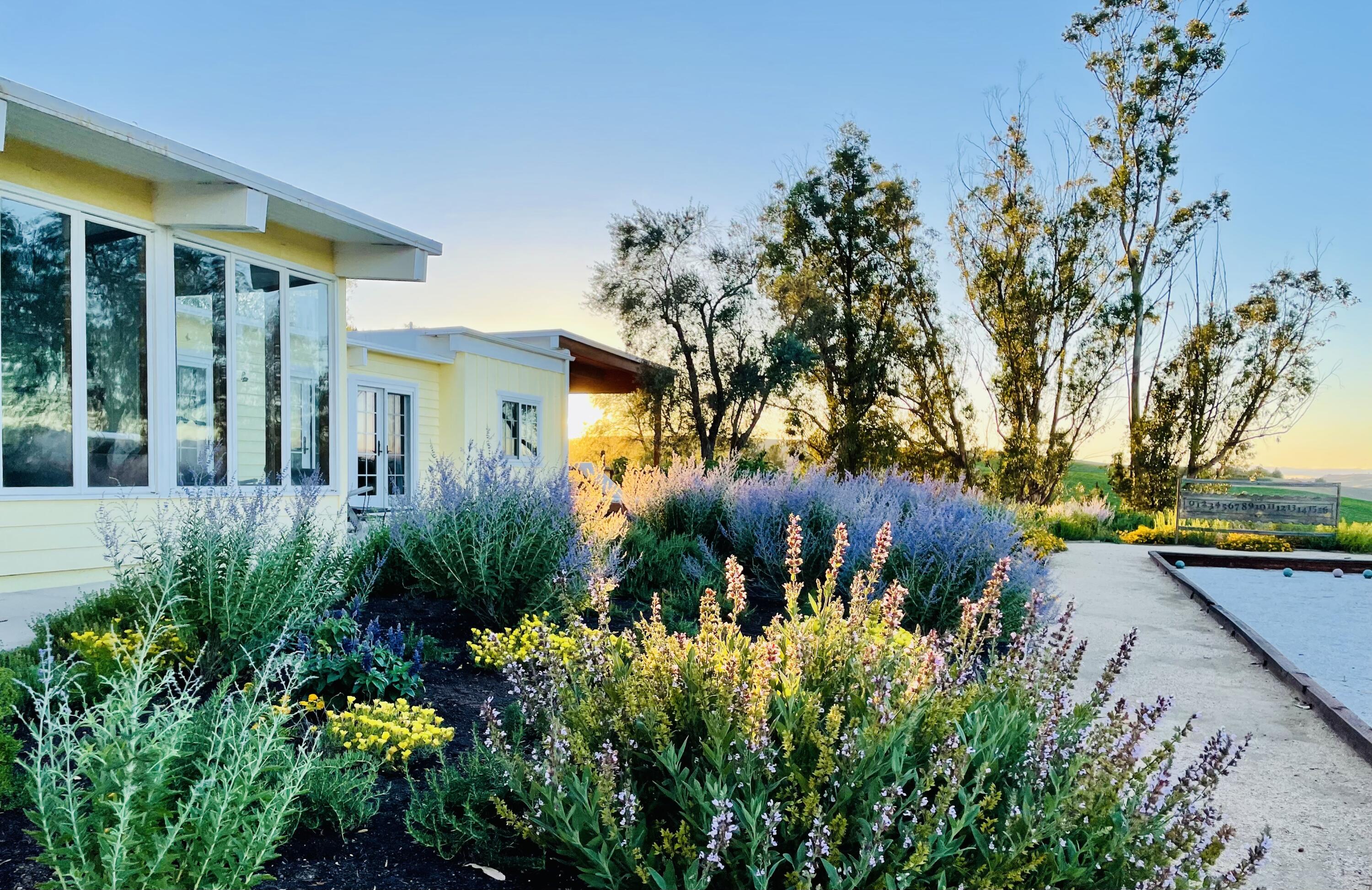 2852 Tapadero Road Solvang, CA 93463 - Photo 23 of 52 a view of a garden with plants and large trees