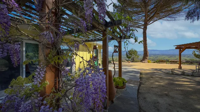 a view of porch with a table chairs and a table