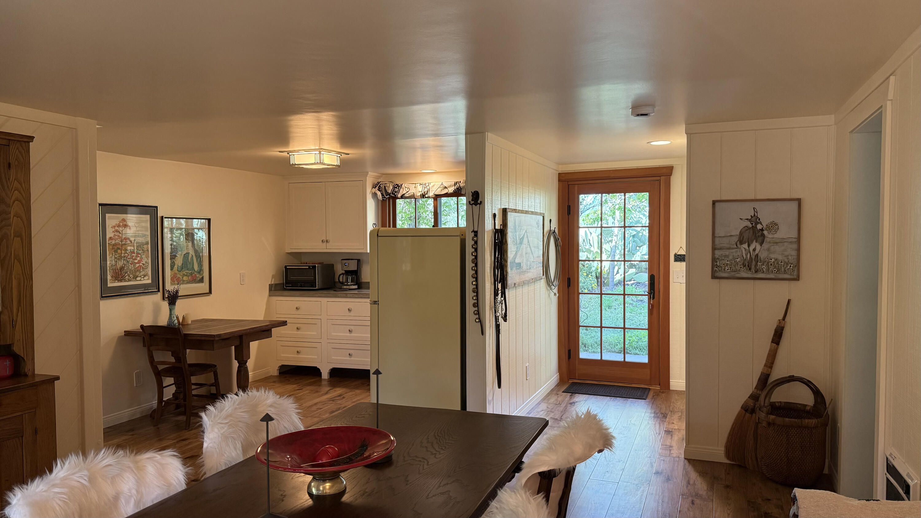 2852 Tapadero Road Solvang, CA 93463 - Photo 43 of 52 a living room with furniture a large window and wood floor