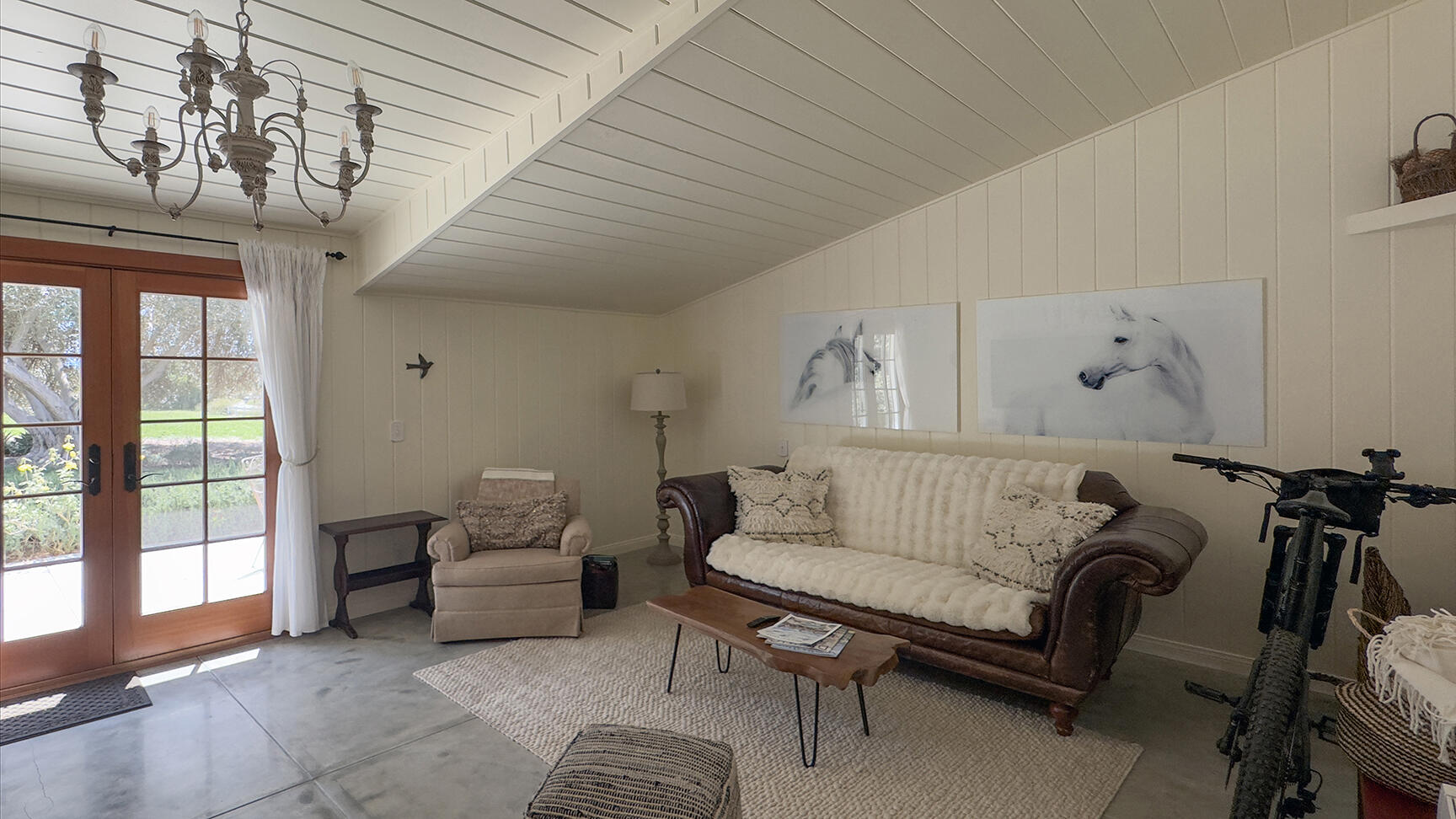 2852 Tapadero Road Solvang, CA 93463 - Photo 44 of 52 a bedroom with furniture and a chandelier