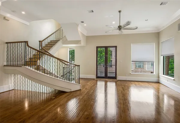 a view of an entryway with wooden floor