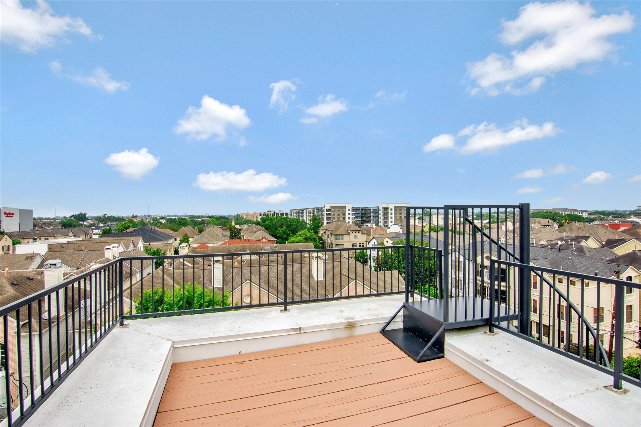5505 Rose Street Houston, TX 77007 - Photo 32 of 35 a view of a balcony with wooden floor & fence