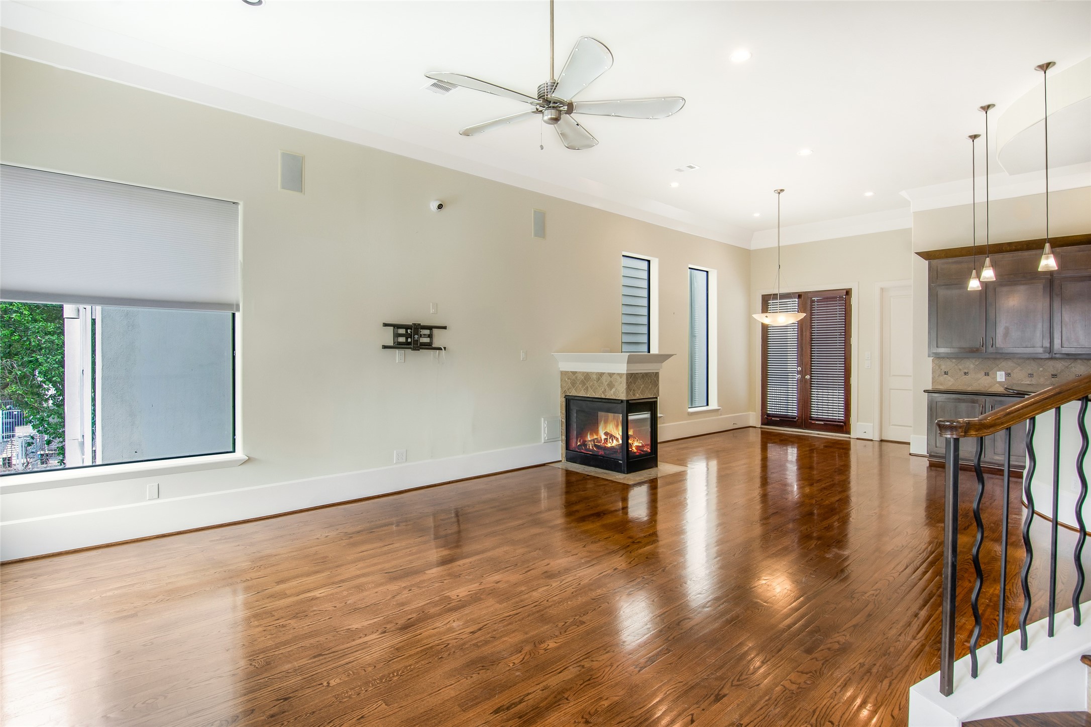 5505 Rose Street Houston, TX 77007 - Photo 8 of 35 a view of empty room with wooden floor and fireplace