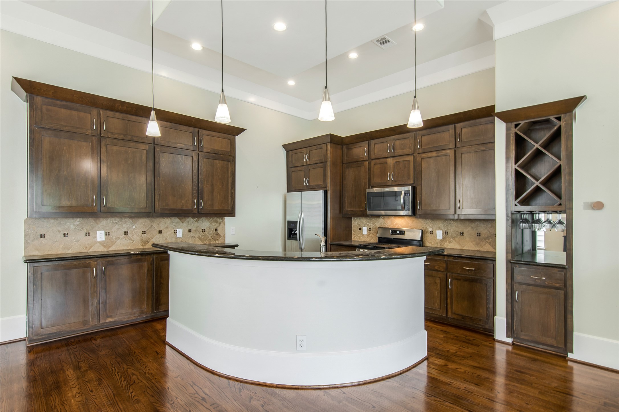 5505 Rose Street Houston, TX 77007 - Photo 9 of 35 a kitchen with stainless steel appliances granite countertop a sink a stove and a refrigerator