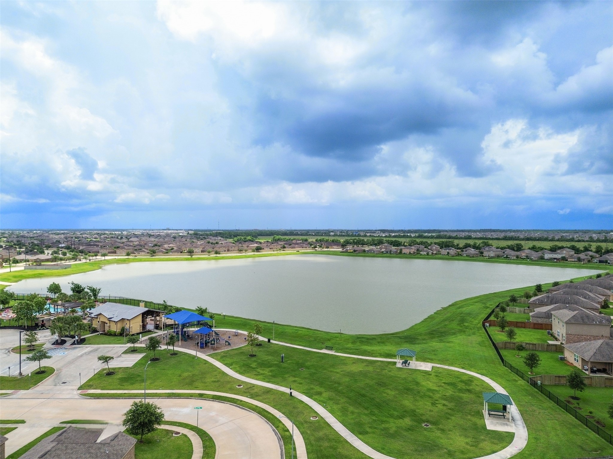 9426 Grand Spark Drive Rosharon, TX 77583 - Photo 28 of 31 Walking trails and open green spaces invite residents to slow down, enjoy the outdoors, and take in the natural beauty surrounding the neighborhood.