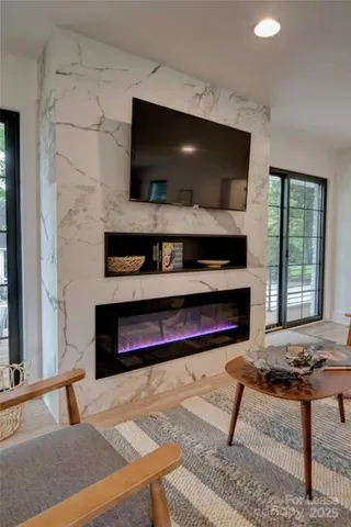 a living room with furniture and a flat screen tv