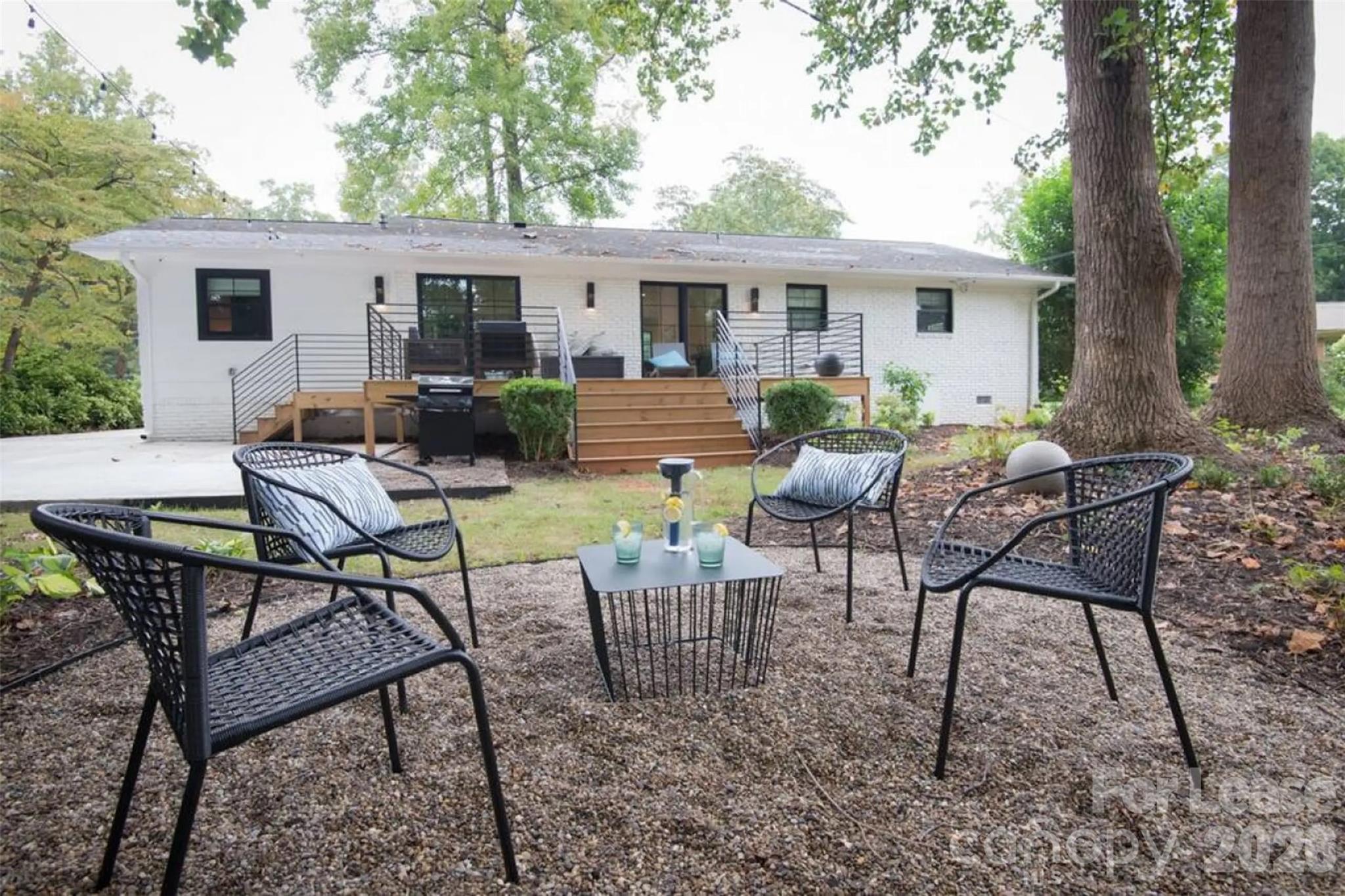 3945 Rockfern Road, Unit A Charlotte, NC 28217 - Photo 12 of 38 a view of a house with backyard and sitting area