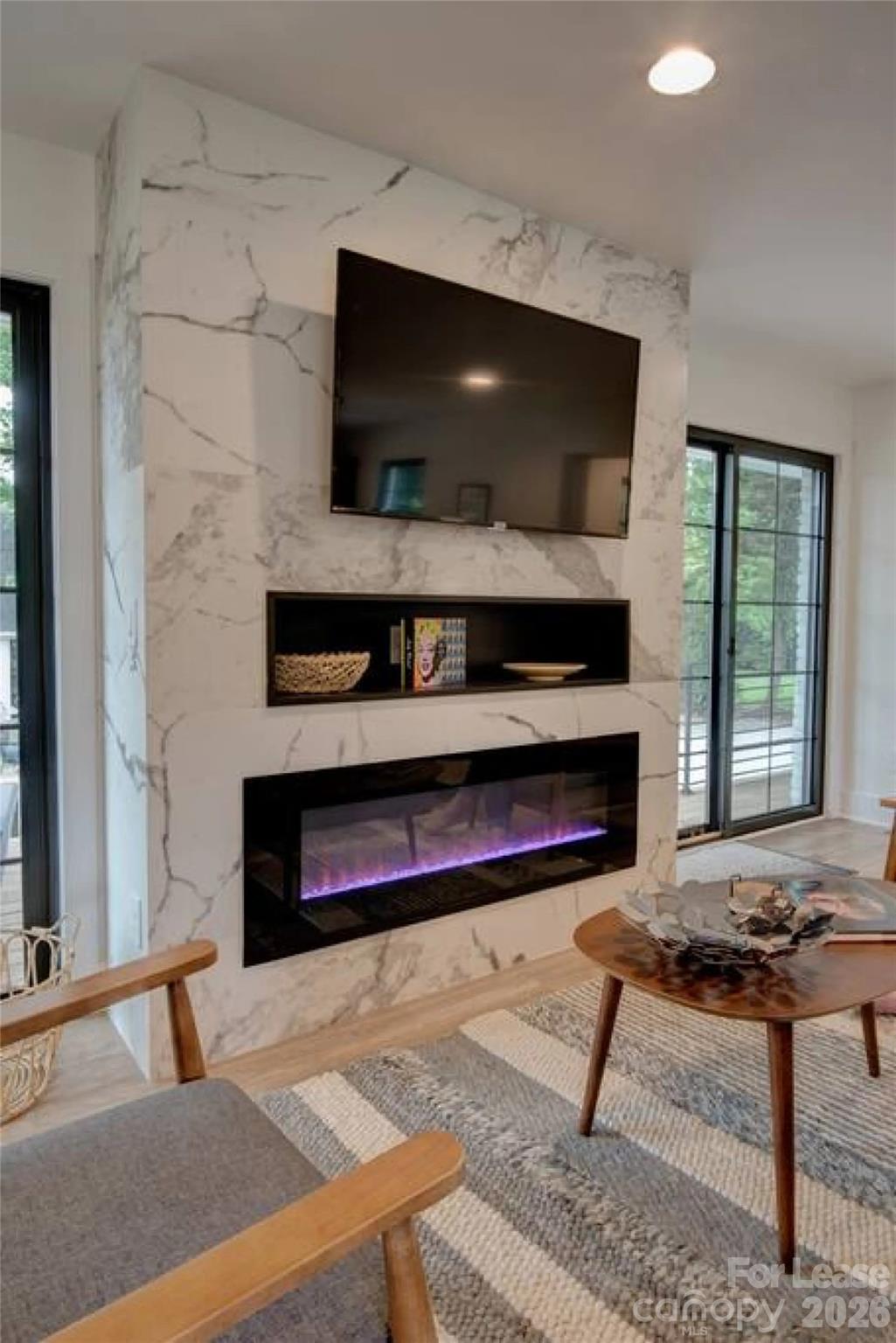 3945 Rockfern Road, Unit A Charlotte, NC 28217 - Photo 13 of 38 a living room with furniture and a flat screen tv