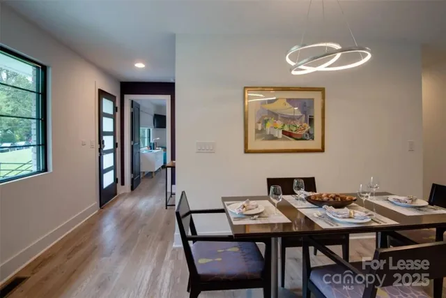 a view of a dining room with furniture and window