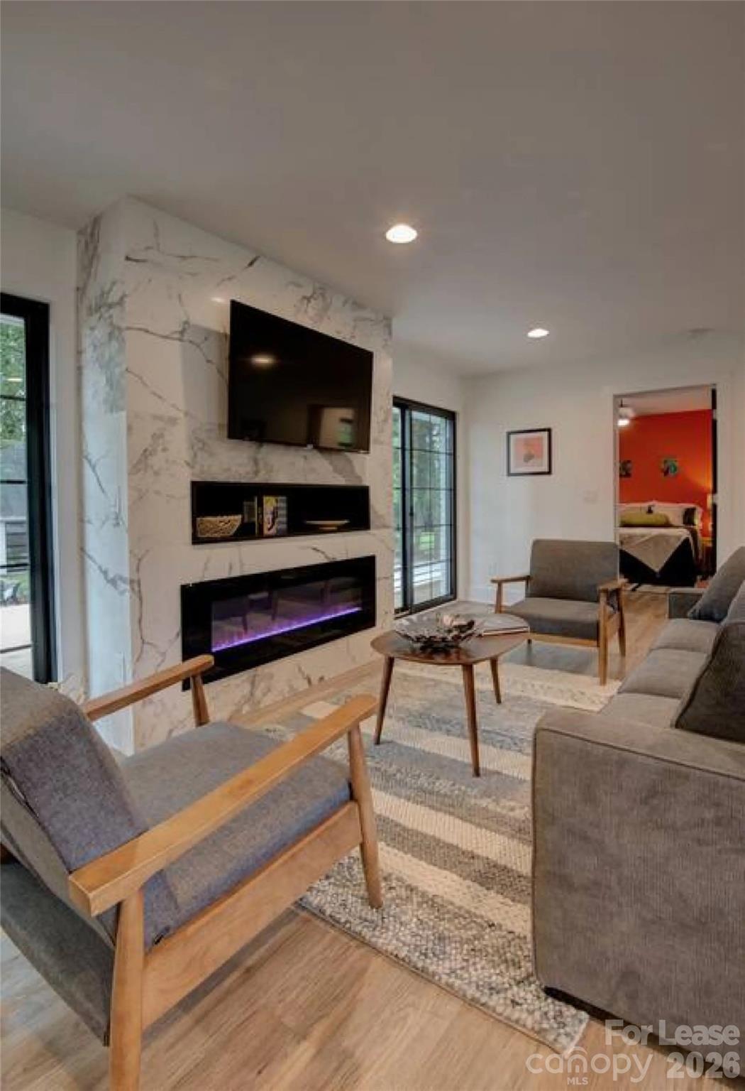 3945 Rockfern Road, Unit A Charlotte, NC 28217 - Photo 2 of 38 a living room with furniture and a flat screen tv
