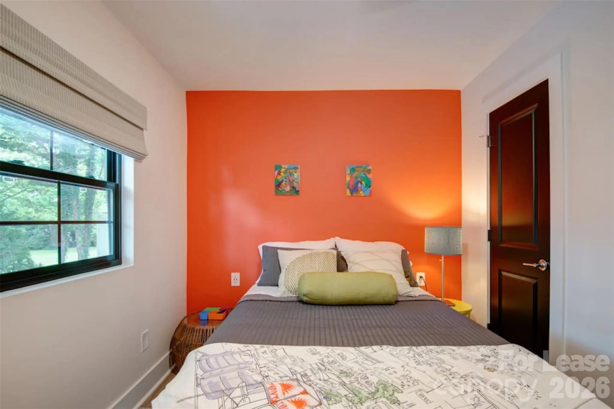3945 Rockfern Road, Unit A Charlotte, NC 28217 - Photo 23 of 38 a bedroom with a bed and window