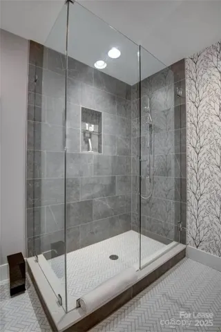 a bathroom with a shower and a bathtub