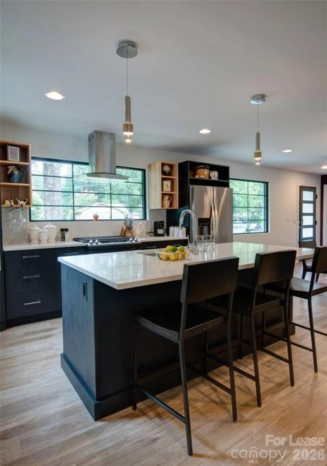 3945 Rockfern Road, Unit A Charlotte, NC 28217 - Photo 3 of 38 a kitchen with a sink cabinets and window