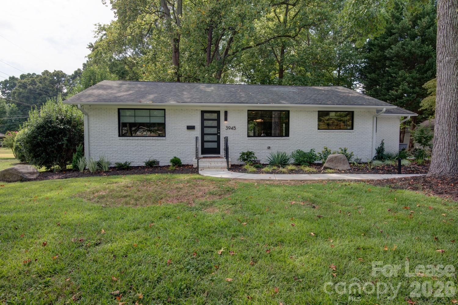 3945 Rockfern Road, Unit A Charlotte, NC 28217 - Photo 33 of 38 a view of a house with yard