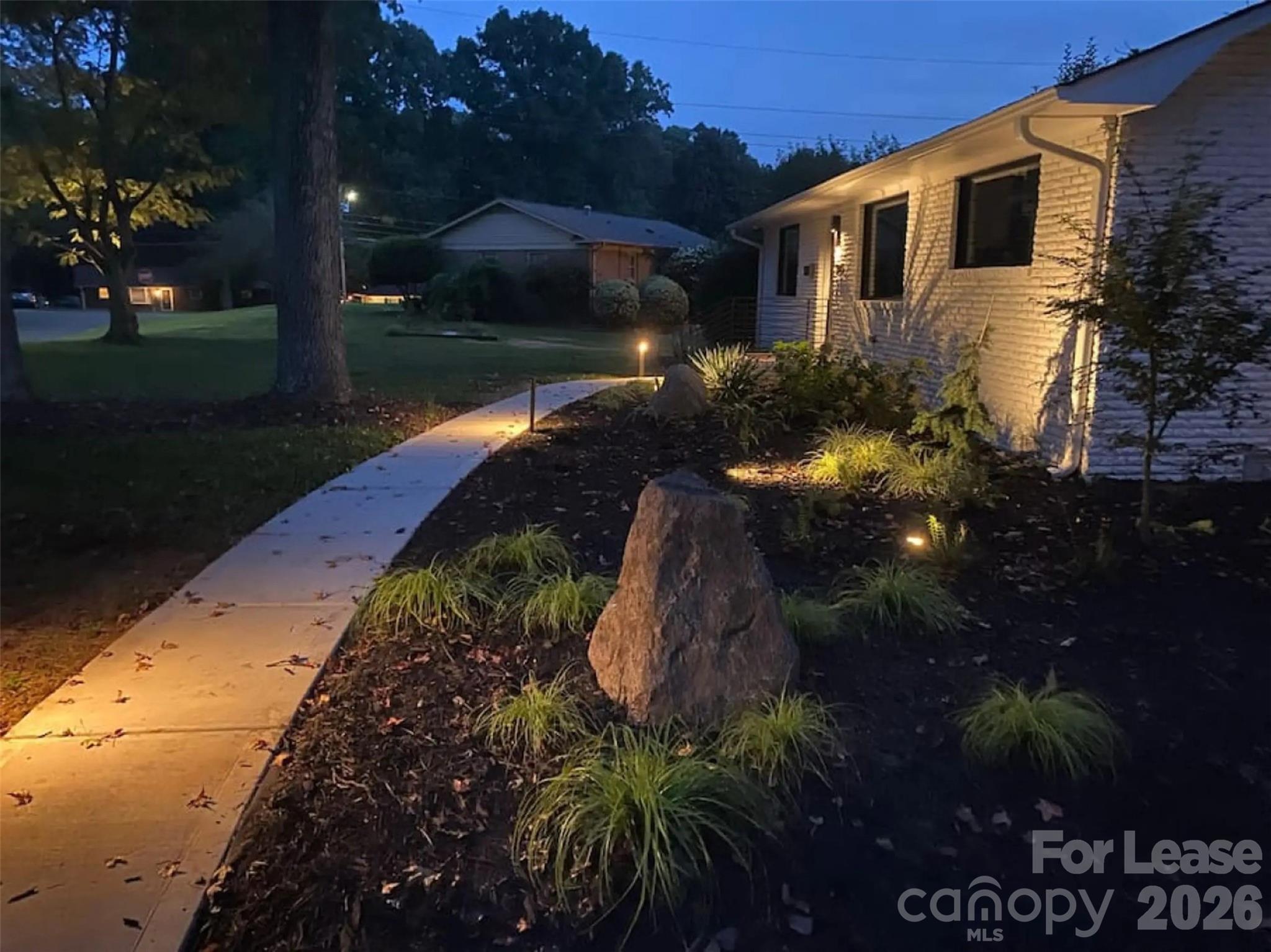3945 Rockfern Road, Unit A Charlotte, NC 28217 - Photo 37 of 38 a view of a house with a yard