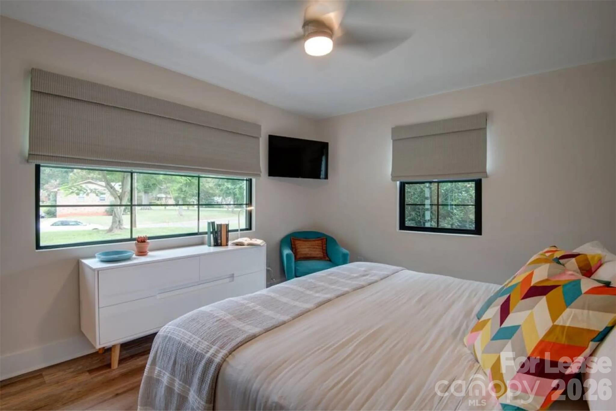 3945 Rockfern Road, Unit A Charlotte, NC 28217 - Photo 5 of 38 a bedroom with a bed and a window