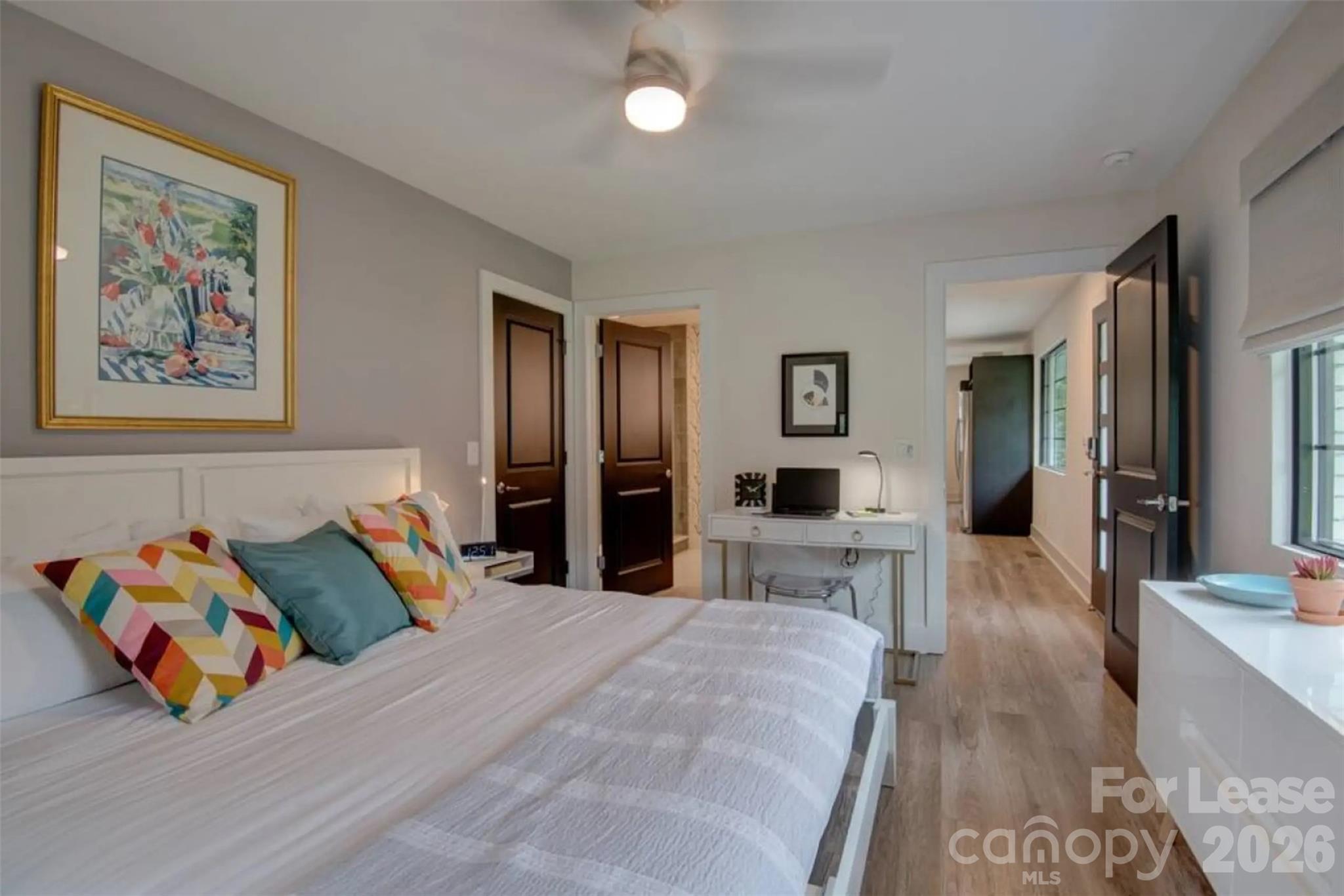 3945 Rockfern Road, Unit A Charlotte, NC 28217 - Photo 10 of 38 a bedroom with furniture and a wooden floor