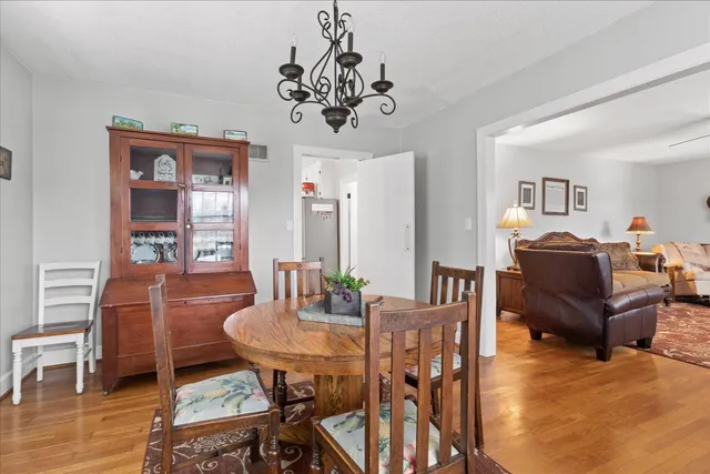 a kitchen with granite countertop white cabinets and window