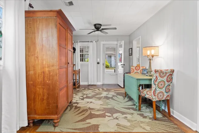 a bedroom with bed and a chandelier