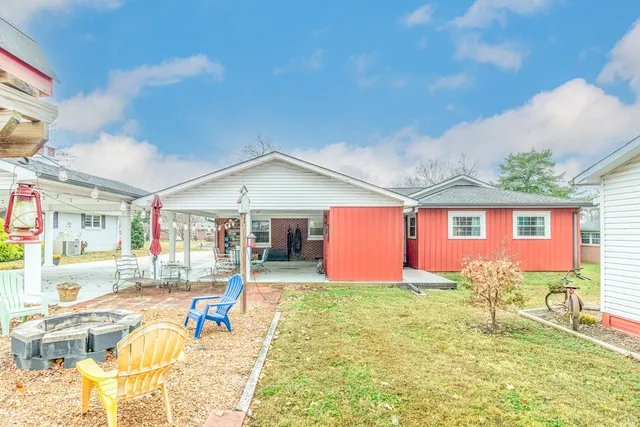 a front view of house with yard and glass windows